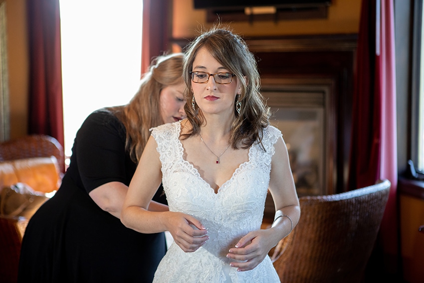 bride getting ready at banner elk winery for elopement